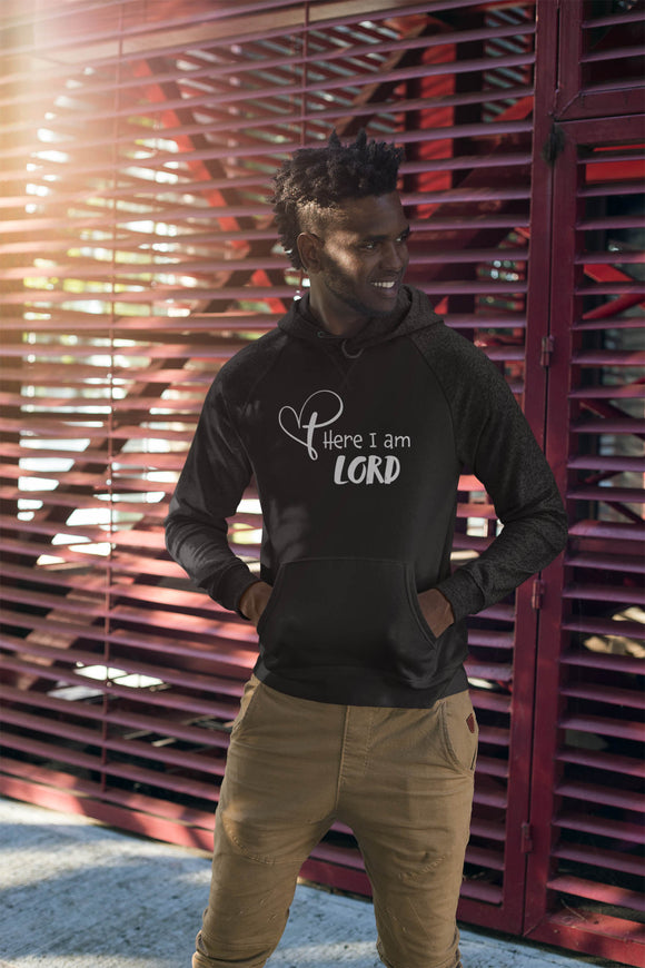 Young man wearing a black sweatshirt with the words Here I am Lord and our signature cross-heart logo